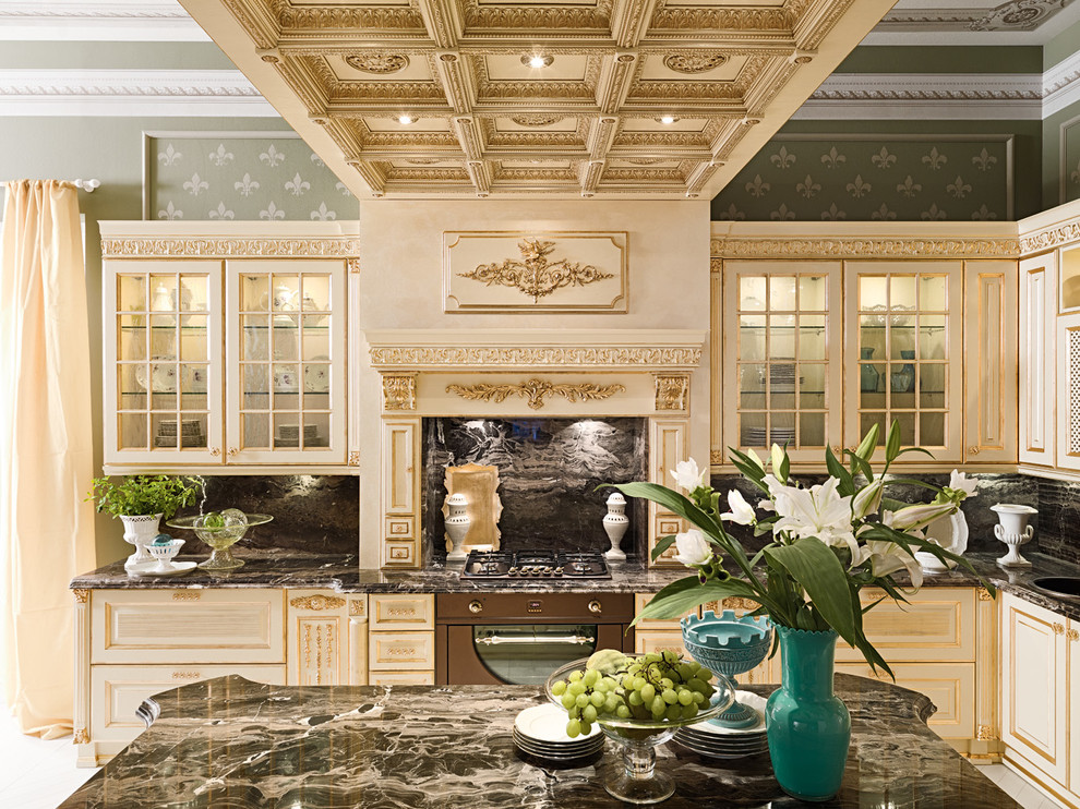 Example of a huge ornate galley medium tone wood floor eat-in kitchen design in Moscow with an undermount sink, raised-panel cabinets, white cabinets, marble countertops, black backsplash, stone slab backsplash, black appliances and an island
