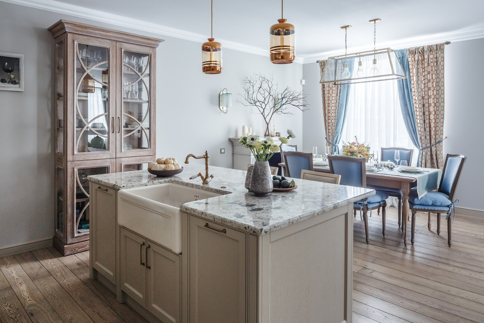 Inspiration for a transitional single-wall medium tone wood floor and brown floor eat-in kitchen remodel in Moscow with a farmhouse sink and an island
