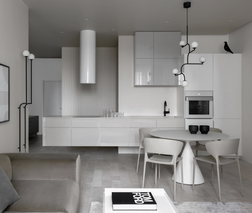 Eat-in kitchen - mid-sized contemporary single-wall porcelain tile and beige floor eat-in kitchen idea in Moscow with an integrated sink, flat-panel cabinets, beige cabinets, solid surface countertops, beige backsplash and beige countertops