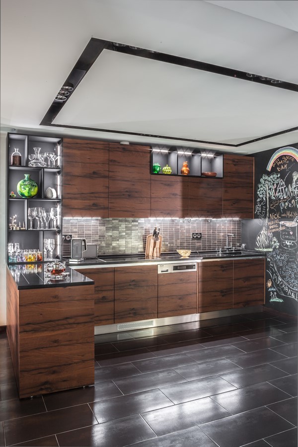 Example of an urban l-shaped kitchen design in Moscow with flat-panel cabinets, dark wood cabinets, brown backsplash, paneled appliances and a peninsula