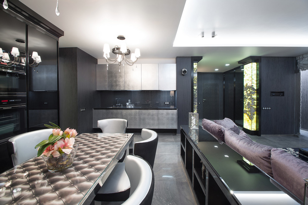 Inspiration for a contemporary single-wall open plan kitchen in Other with flat-panel cabinets, grey cabinets, black splashback and black appliances.