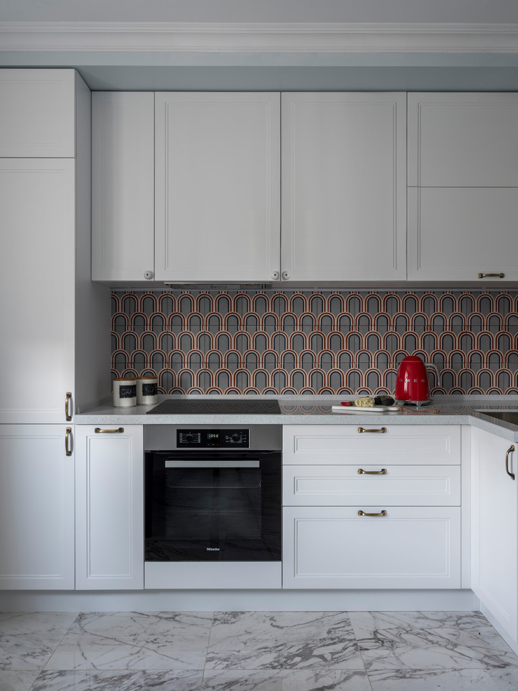 This is an example of a contemporary l-shaped enclosed kitchen in Moscow with a submerged sink, recessed-panel cabinets, white cabinets, multi-coloured splashback, stainless steel appliances, grey floors and grey worktops.
