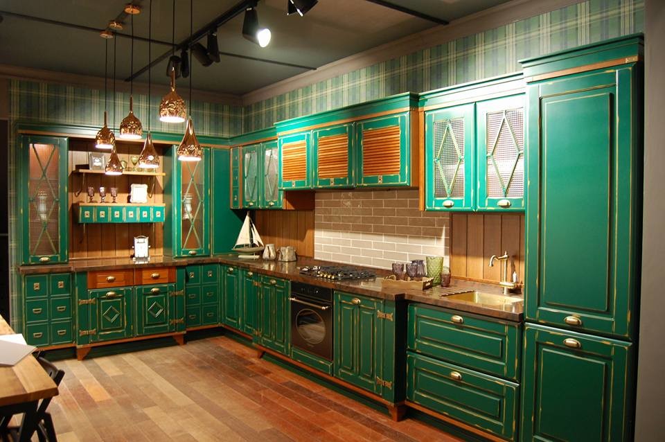 Design ideas for a medium sized farmhouse l-shaped kitchen/diner in Moscow with recessed-panel cabinets, green cabinets, composite countertops, brown splashback, wood splashback and coloured appliances.