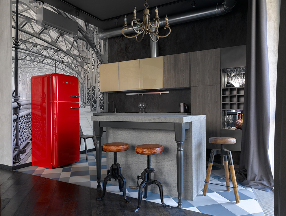 Modelo de cocina lineal bohemia abierta con armarios con paneles lisos, salpicadero negro, una isla y electrodomésticos de colores
