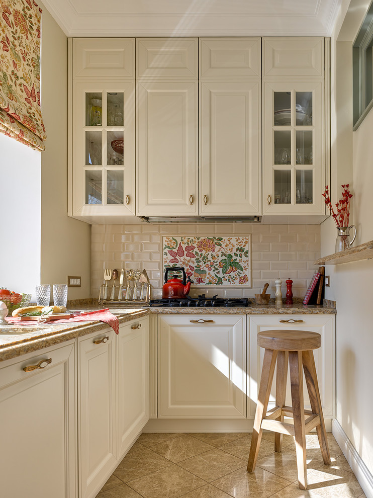 Inspiration for a transitional l-shaped beige floor kitchen remodel in Moscow with raised-panel cabinets, white cabinets, beige backsplash, subway tile backsplash and beige countertops