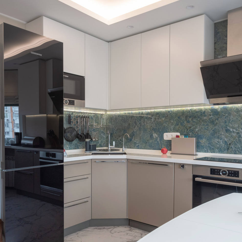 Medium sized contemporary grey and white l-shaped kitchen/diner in Moscow with a submerged sink, flat-panel cabinets, beige cabinets, composite countertops, grey splashback, ceramic splashback, integrated appliances, ceramic flooring, no island, grey floors, white worktops, a drop ceiling and feature lighting.