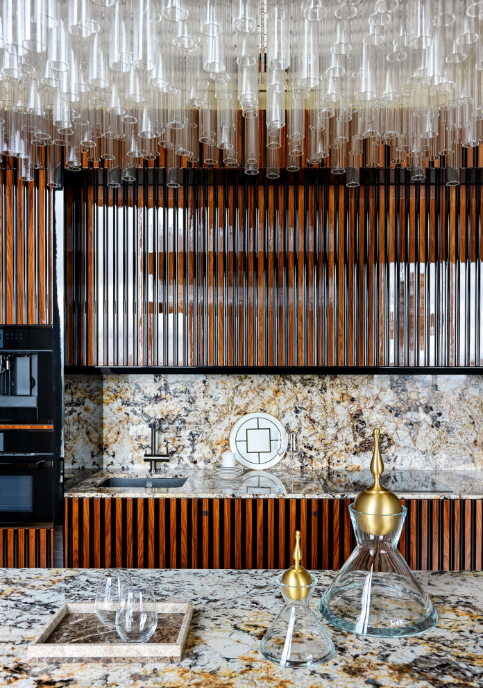 Foto de cocina contemporánea con fregadero bajoencimera, puertas de armario de madera oscura y encimeras multicolor