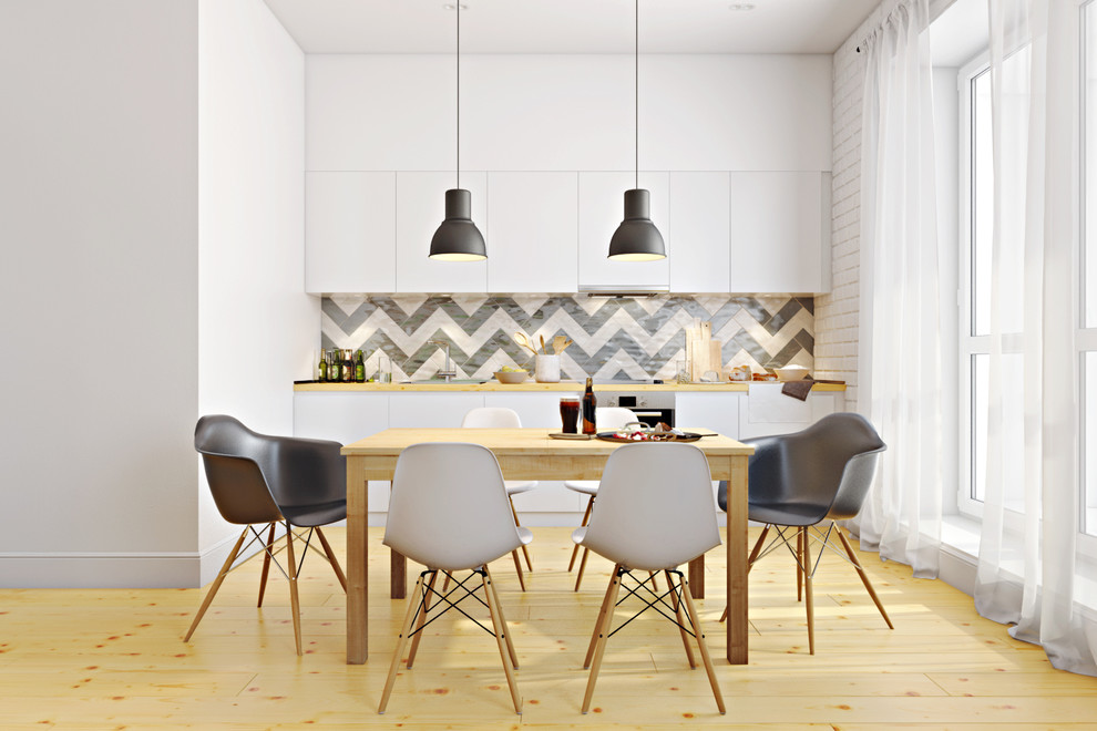 Idee per una sala da pranzo aperta verso il soggiorno scandinava di medie dimensioni con pavimento in legno massello medio e pavimento beige