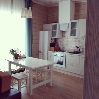 Closeup of classic cream-colored kitchen with appliances Stock Photo by  staRRush