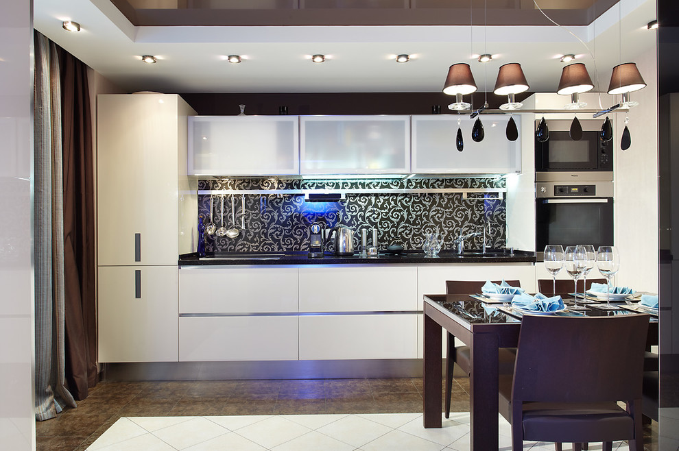 Medium sized contemporary single-wall kitchen/diner in Saint Petersburg with an integrated sink, flat-panel cabinets, beige cabinets, composite countertops, multi-coloured splashback, glass sheet splashback, stainless steel appliances, ceramic flooring, no island, multi-coloured floors and brown worktops.