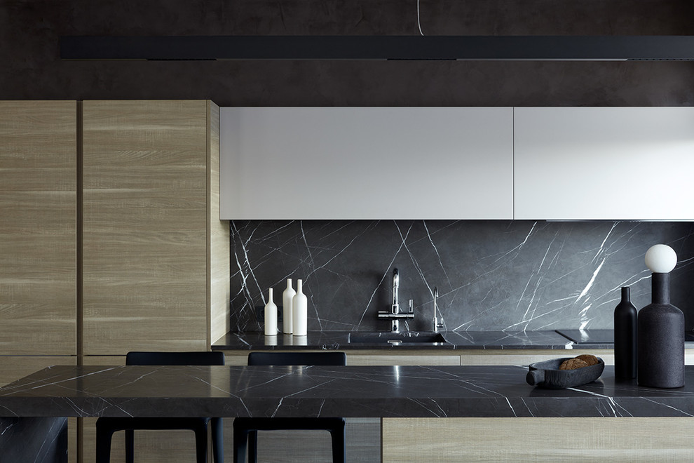 Design ideas for a contemporary single-wall kitchen in Moscow with a submerged sink, flat-panel cabinets, medium wood cabinets, marble worktops, grey splashback, marble splashback, black appliances, an island and grey worktops.