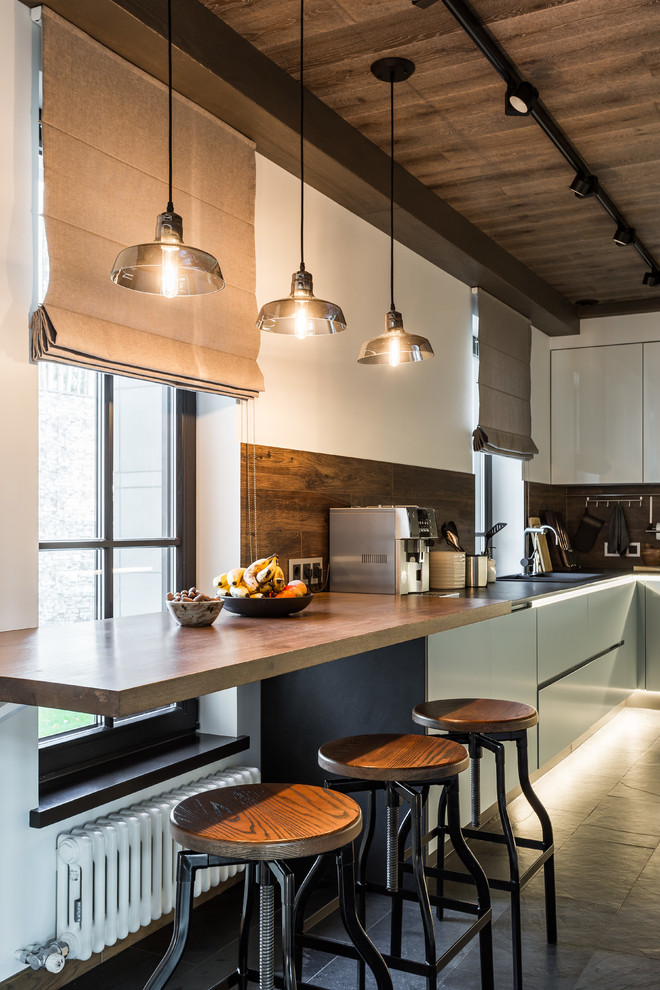 Example of a large trendy single-wall porcelain tile and gray floor eat-in kitchen design in Moscow with an undermount sink, flat-panel cabinets, blue cabinets, wood countertops, brown backsplash, wood backsplash, no island and brown countertops