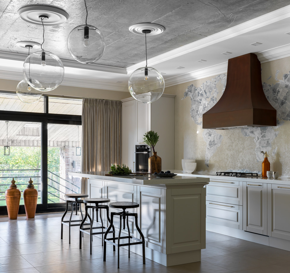 Foto di una cucina design con ante con riquadro incassato, ante bianche, pavimento in gres porcellanato e pavimento grigio