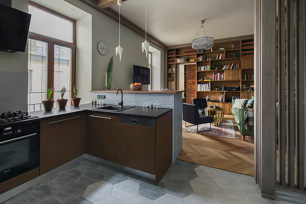 Example of a trendy u-shaped gray floor open concept kitchen design in Saint Petersburg with a drop-in sink, flat-panel cabinets, brown cabinets, gray backsplash, black appliances and no island