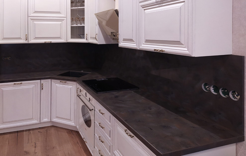 Photo of a small contemporary l-shaped kitchen in Saint Petersburg with composite countertops.