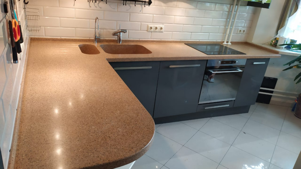 Inspiration for a large contemporary l-shaped kitchen/diner in Moscow with a double-bowl sink, grey cabinets, composite countertops, no island and brown worktops.