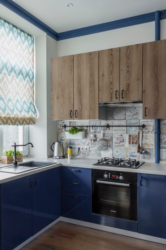 Example of a small eclectic u-shaped dark wood floor and brown floor open concept kitchen design in Moscow with flat-panel cabinets, blue cabinets, multicolored backsplash, no island, a drop-in sink, black appliances and window backsplash