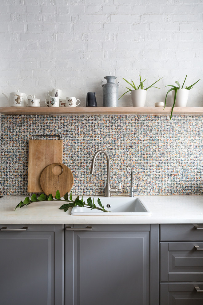 Inspiration for a contemporary single-wall kitchen remodel in Moscow with a drop-in sink, raised-panel cabinets, gray cabinets, multicolored backsplash and mosaic tile backsplash