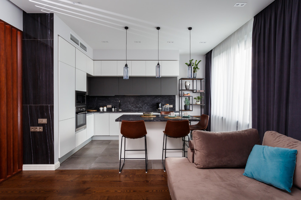 This is an example of a small scandinavian l-shaped open plan kitchen in Moscow with flat-panel cabinets, white cabinets, composite countertops, grey splashback, stainless steel appliances, porcelain flooring, an island, grey floors and grey worktops.
