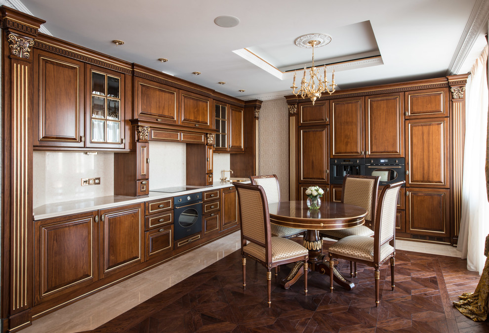 Example of a large classic l-shaped dark wood floor eat-in kitchen design in Moscow with raised-panel cabinets, marble countertops, beige backsplash, black appliances, medium tone wood cabinets and no island