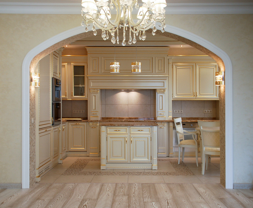 This is an example of a large classic l-shaped kitchen/diner in Moscow with a built-in sink, raised-panel cabinets, beige cabinets, marble worktops, beige splashback, porcelain splashback, stainless steel appliances, porcelain flooring and an island.