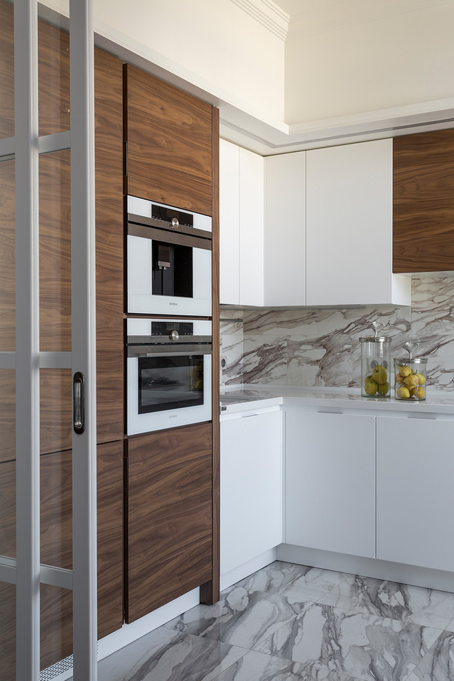 Inspiration for a contemporary l-shaped gray floor enclosed kitchen remodel in Moscow with flat-panel cabinets, dark wood cabinets, white appliances and no island