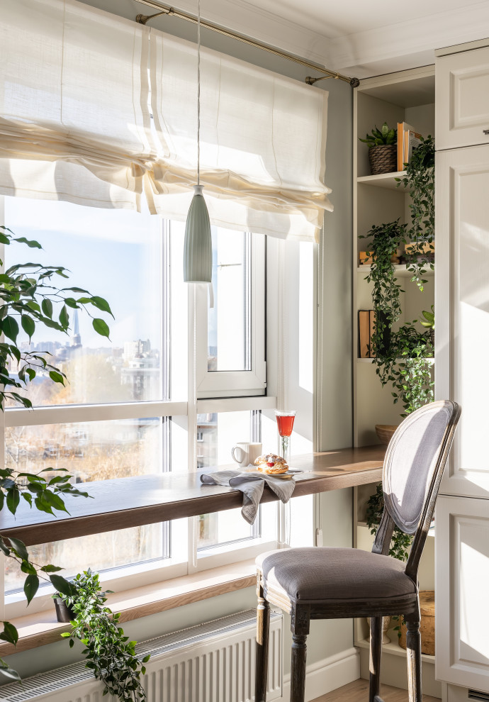 This is an example of a small classic single-wall kitchen/diner in Saint Petersburg with a submerged sink, raised-panel cabinets, beige cabinets, composite countertops, blue splashback, ceramic splashback, laminate floors, no island, beige floors and brown worktops.