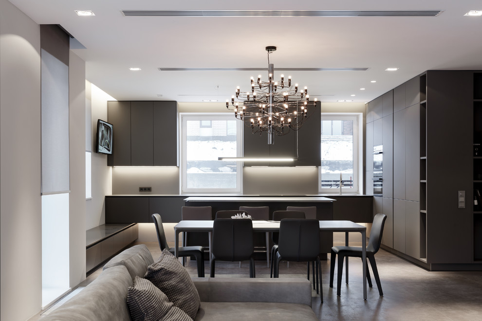 Example of a trendy gray floor open concept kitchen design in Saint Petersburg with an island, flat-panel cabinets, gray cabinets and gray backsplash