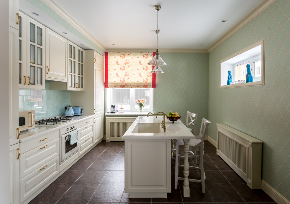 Enclosed kitchen - traditional galley enclosed kitchen idea in Moscow with an undermount sink, raised-panel cabinets, white cabinets, blue backsplash, white appliances, an island and subway tile backsplash