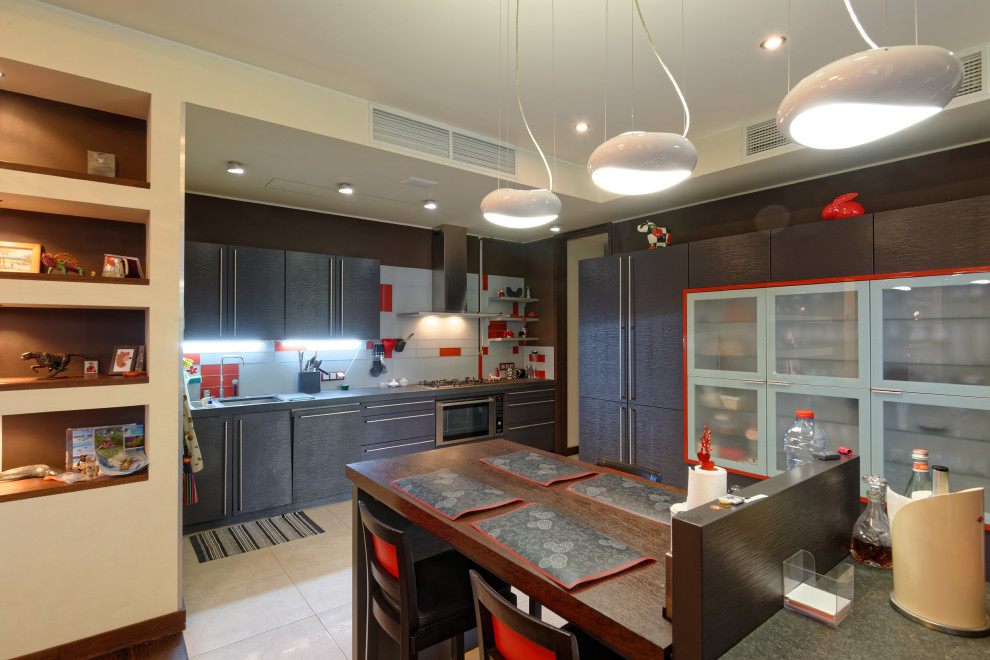 This is an example of a large contemporary l-shaped kitchen/diner in Moscow with a submerged sink, flat-panel cabinets, dark wood cabinets, grey splashback, stainless steel appliances, porcelain flooring, grey floors and grey worktops.