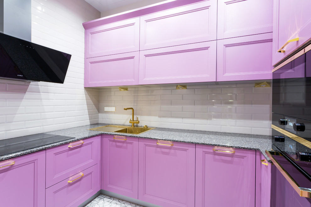 This is an example of a small contemporary grey and purple u-shaped enclosed kitchen in Moscow with recessed-panel cabinets, purple cabinets, granite worktops, white splashback, metro tiled splashback, black appliances, no island, grey floors and a built-in sink.