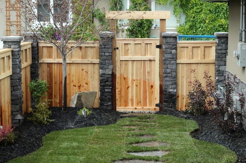 This is an example of a small traditional front yard concrete paver landscaping in Calgary.