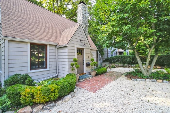 Small traditional front driveway full sun garden in New York with a garden path and gravel.