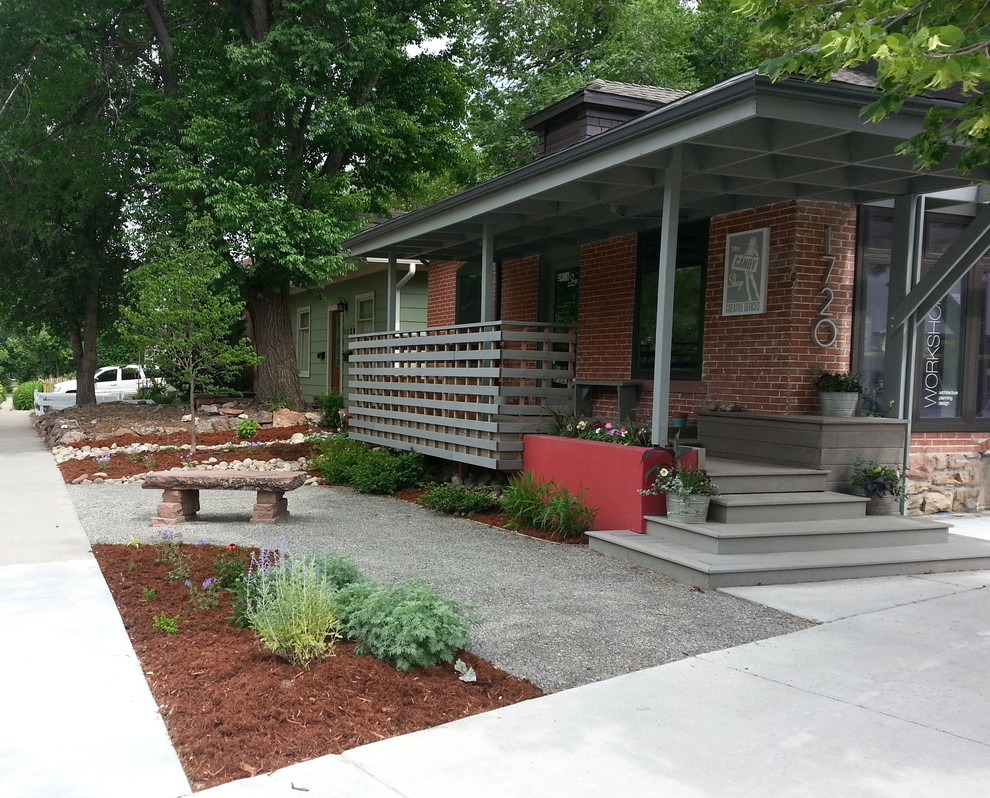 Inspiration for a small modern front xeriscape partial sun garden in Denver with a garden path and gravel.