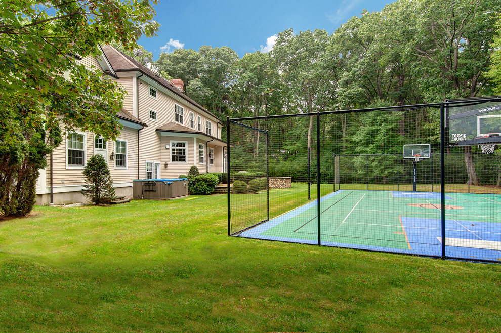 Expansive traditional back garden in Boston with an outdoor sport court.