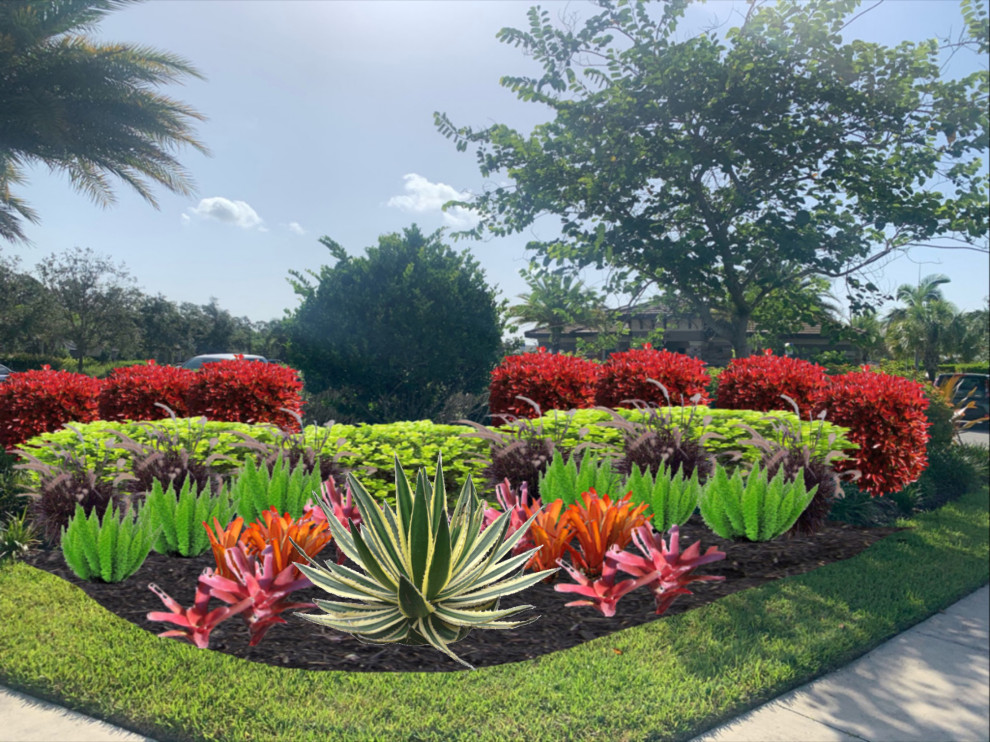 Immagine di un grande giardino formale tropicale esposto in pieno sole dietro casa con un ingresso o sentiero e pavimentazioni in mattoni