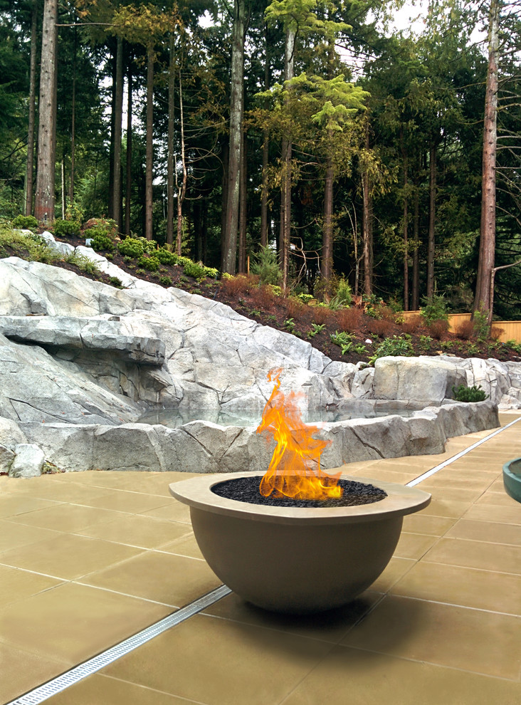 Design ideas for a contemporary patio in Vancouver with a fire feature.