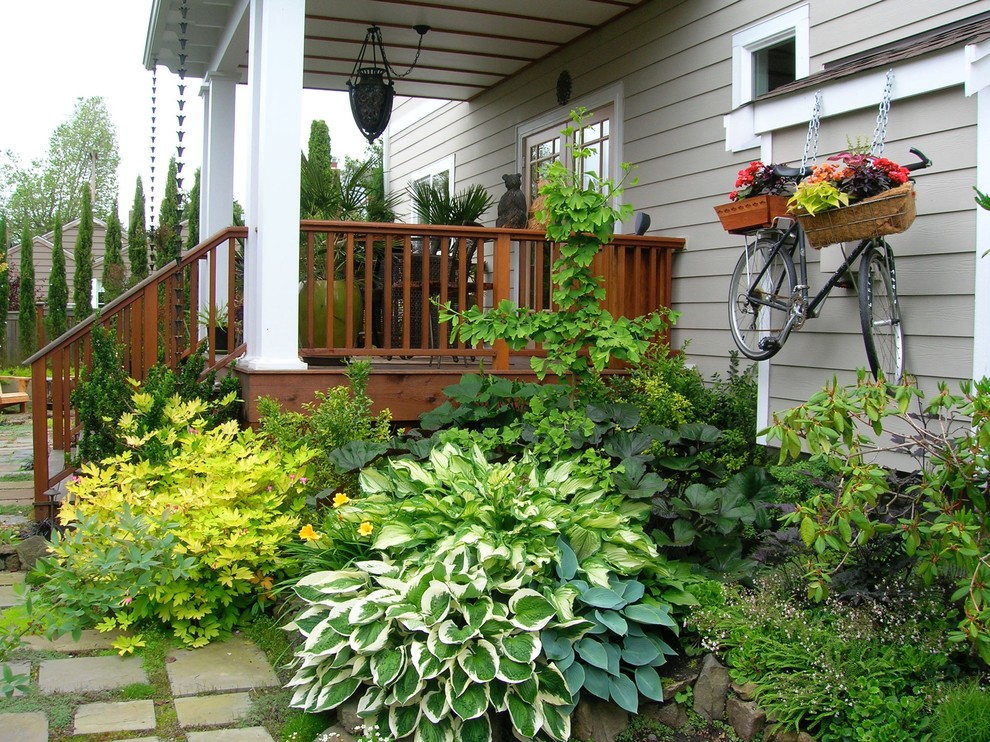 Design ideas for a large craftsman shade front yard stone landscaping in Seattle for spring.
