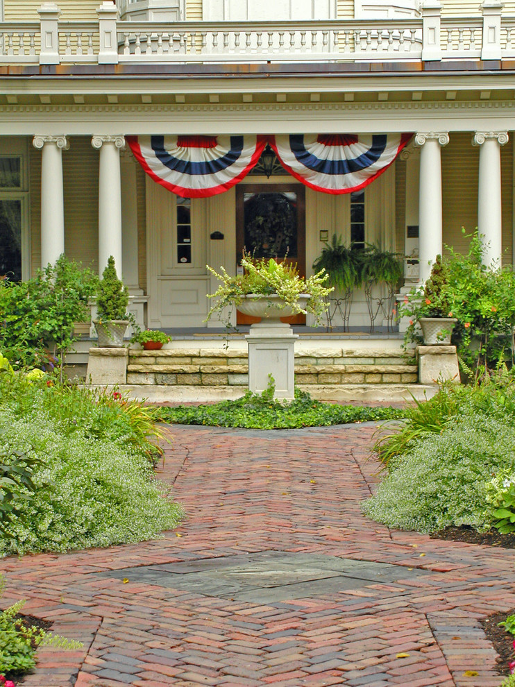 Design ideas for a classic garden in Chicago with a potted garden and brick paving.