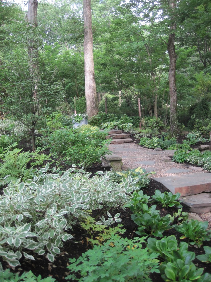 Traditional back fully shaded garden steps in New York.