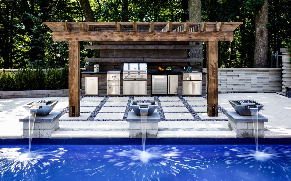 Photo of a medium sized contemporary back garden in New York with a fire feature and natural stone paving.