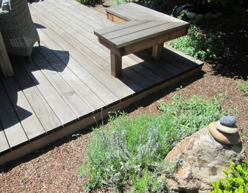 Inspiration for a mid-sized eclectic partial sun backyard landscaping in San Francisco with decking for summer.