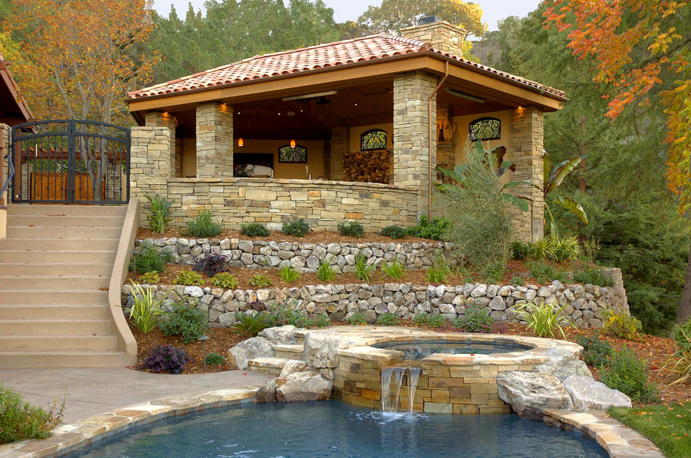 Design ideas for a large mediterranean partial sun hillside stone landscaping in San Francisco.