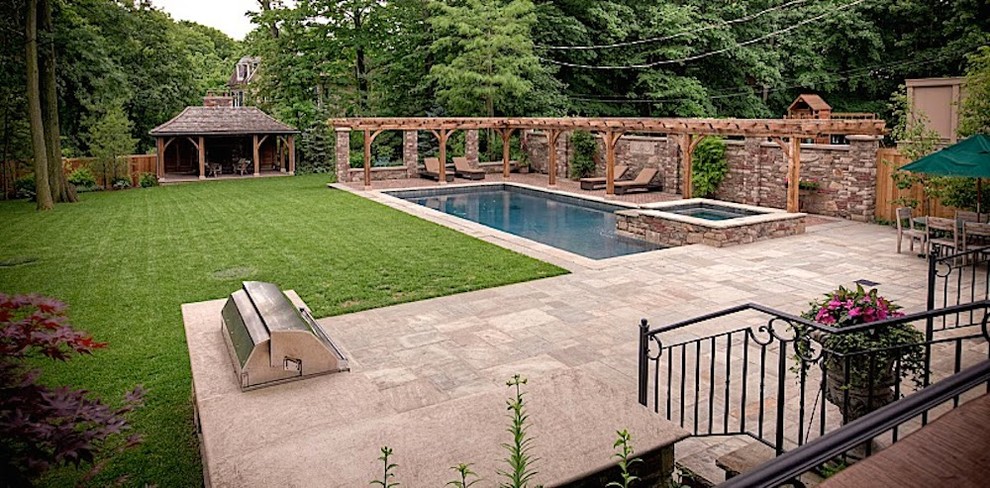 Design ideas for a large traditional back garden in Toronto with brick paving and a garden path.