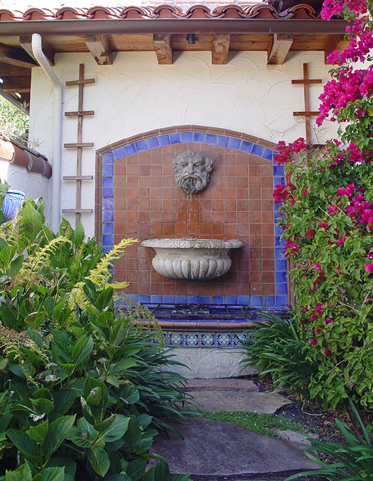 Photo of a mid-sized mediterranean stone water fountain landscape in San Francisco.