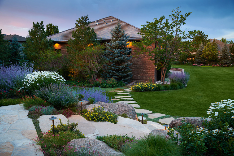 Inspiration for an expansive contemporary back formal garden for summer in Denver with a pathway and natural stone paving.