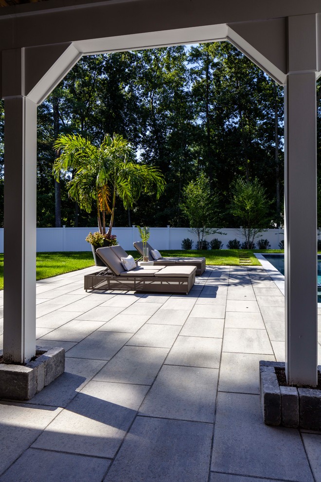 Inspiration for a large contemporary patio in Other with concrete paving.