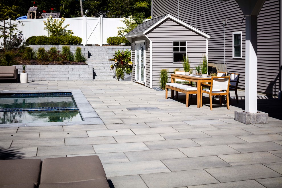 Large contemporary garden in Other with concrete paving.