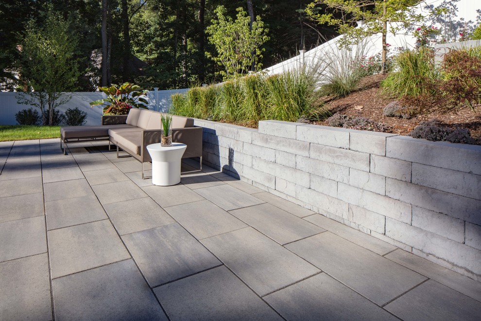 Photo of a large contemporary garden in Other with concrete paving.