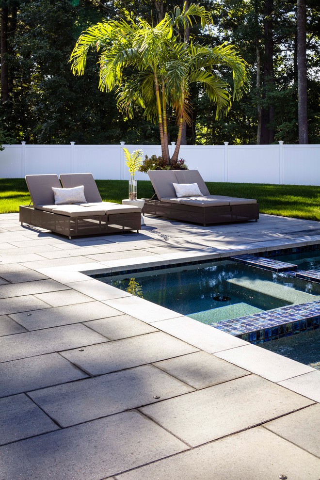Photo of a large contemporary garden in Other with concrete paving.